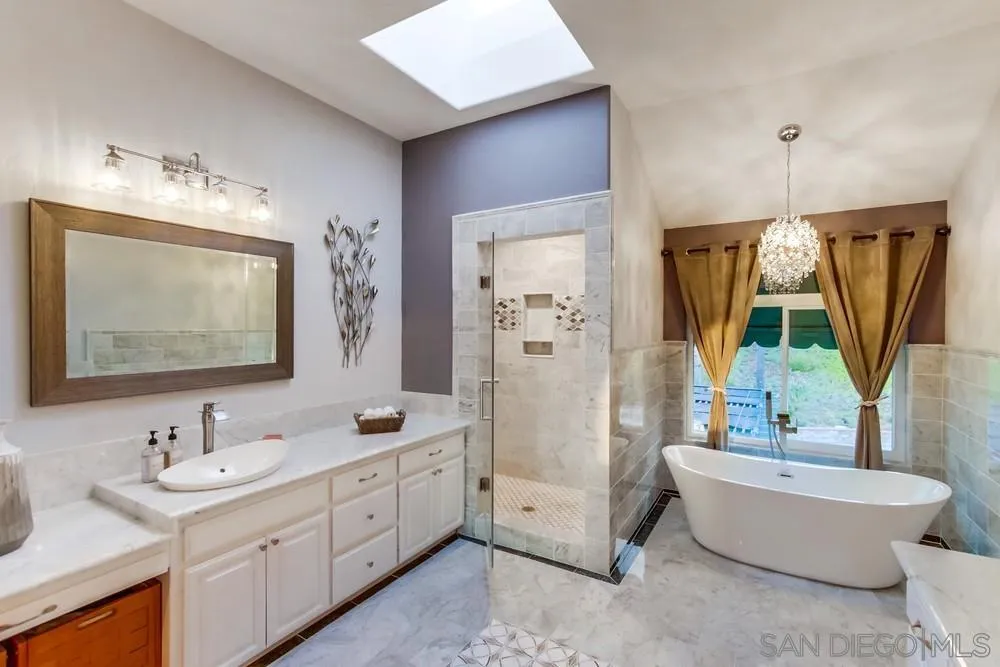 17843 Valle Verde Road Poway, CA 92064 - Photo 44 of 70 a bathroom with a double vanity sink mirror and bathtub