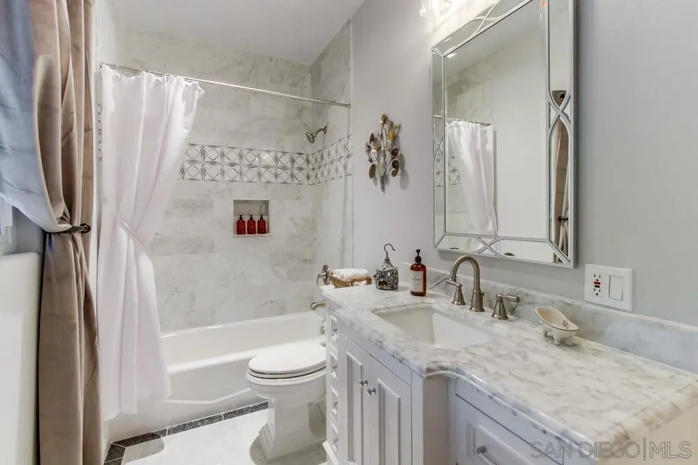 17843 Valle Verde Road Poway, CA 92064 - Photo 56 of 70 a bathroom with a granite countertop sink toilet and shower