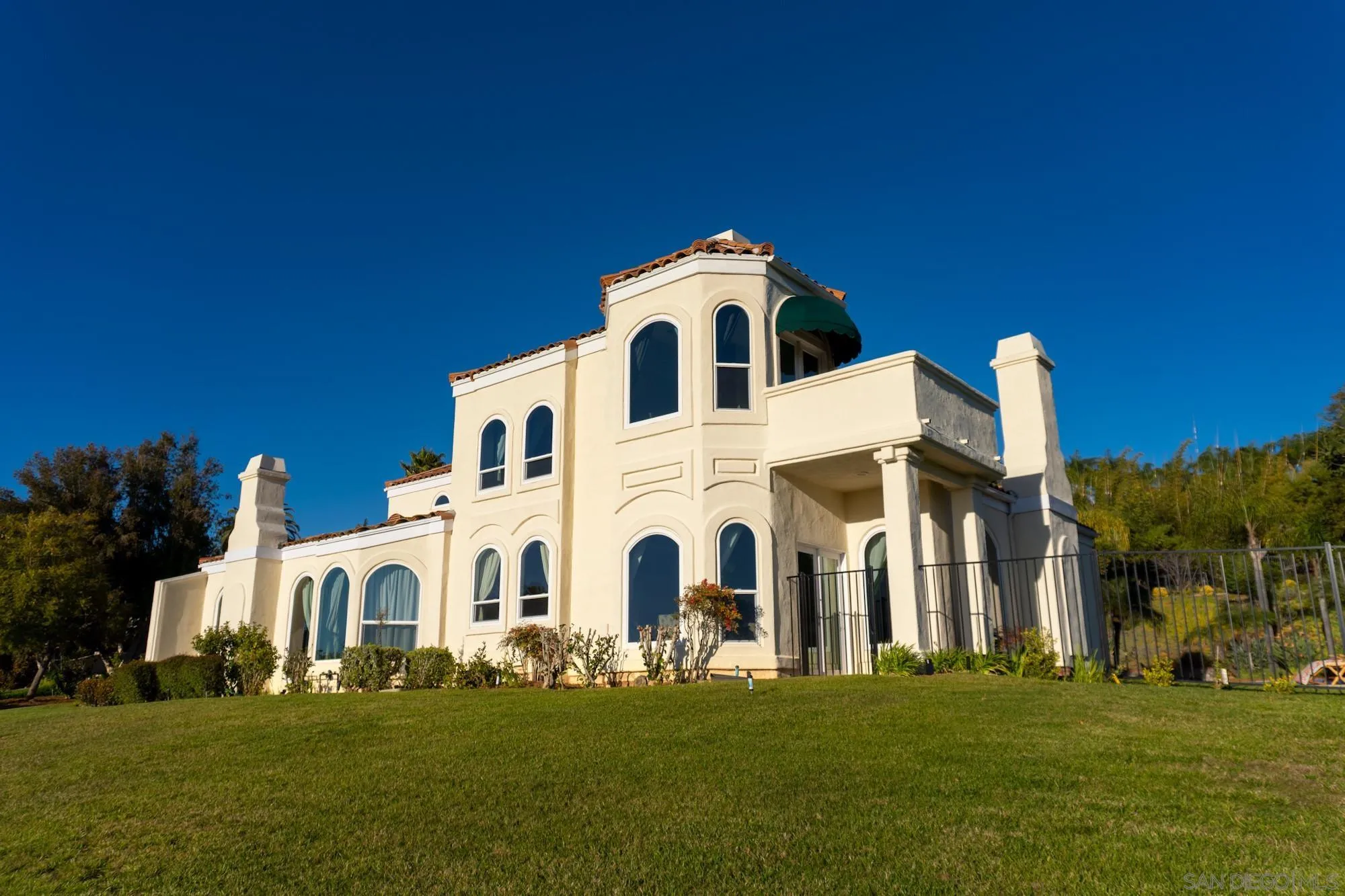 17843 Valle Verde Road Poway, CA 92064 - Photo 65 of 70 a front view of a house with a garden