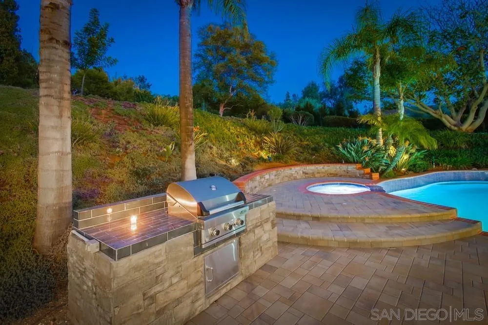 17843 Valle Verde Road Poway, CA 92064 - Photo 8 of 70 a view of a backyard with plants and a yard