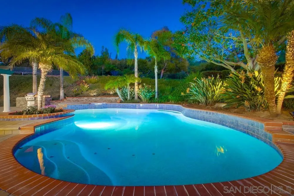 17843 Valle Verde Road Poway, CA 92064 - Photo 10 of 70 a view of a swimming pool with an outdoor space and seating area