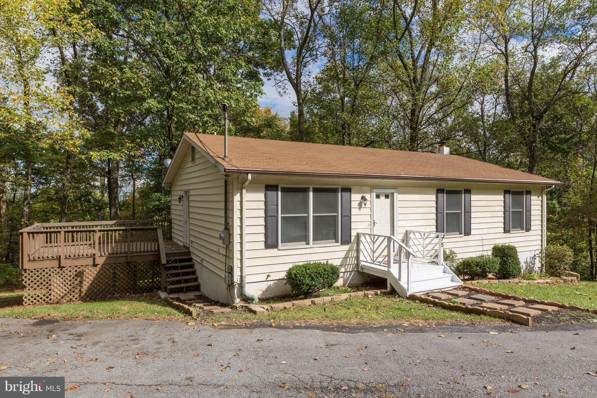 75 Locust Tree Lane Front Royal, VA 22630 - Photo 2 of 27 a front view of a house with garden
