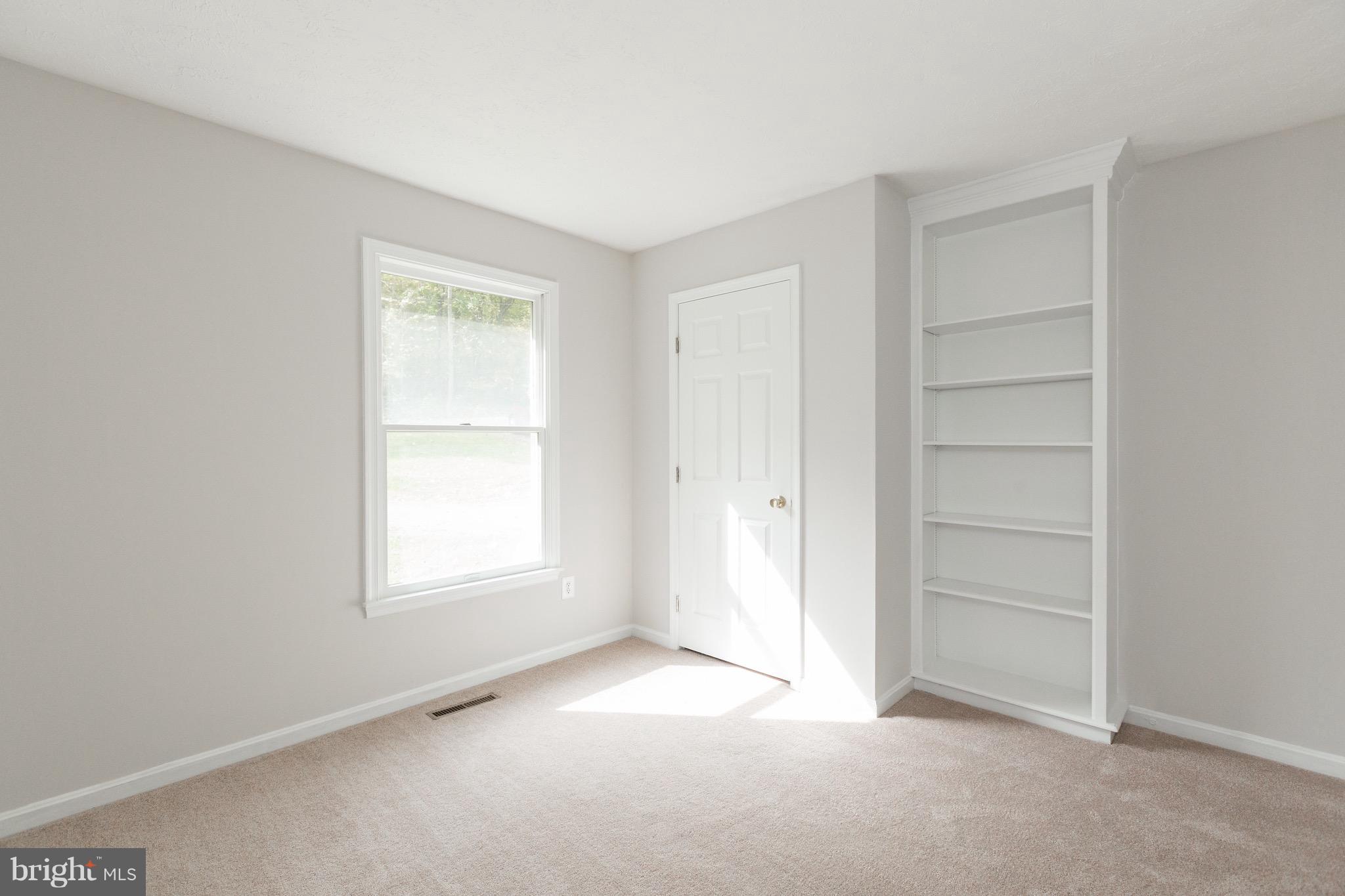 75 Locust Tree Lane Front Royal, VA 22630 - Photo 16 of 27 a view of an empty room with a window