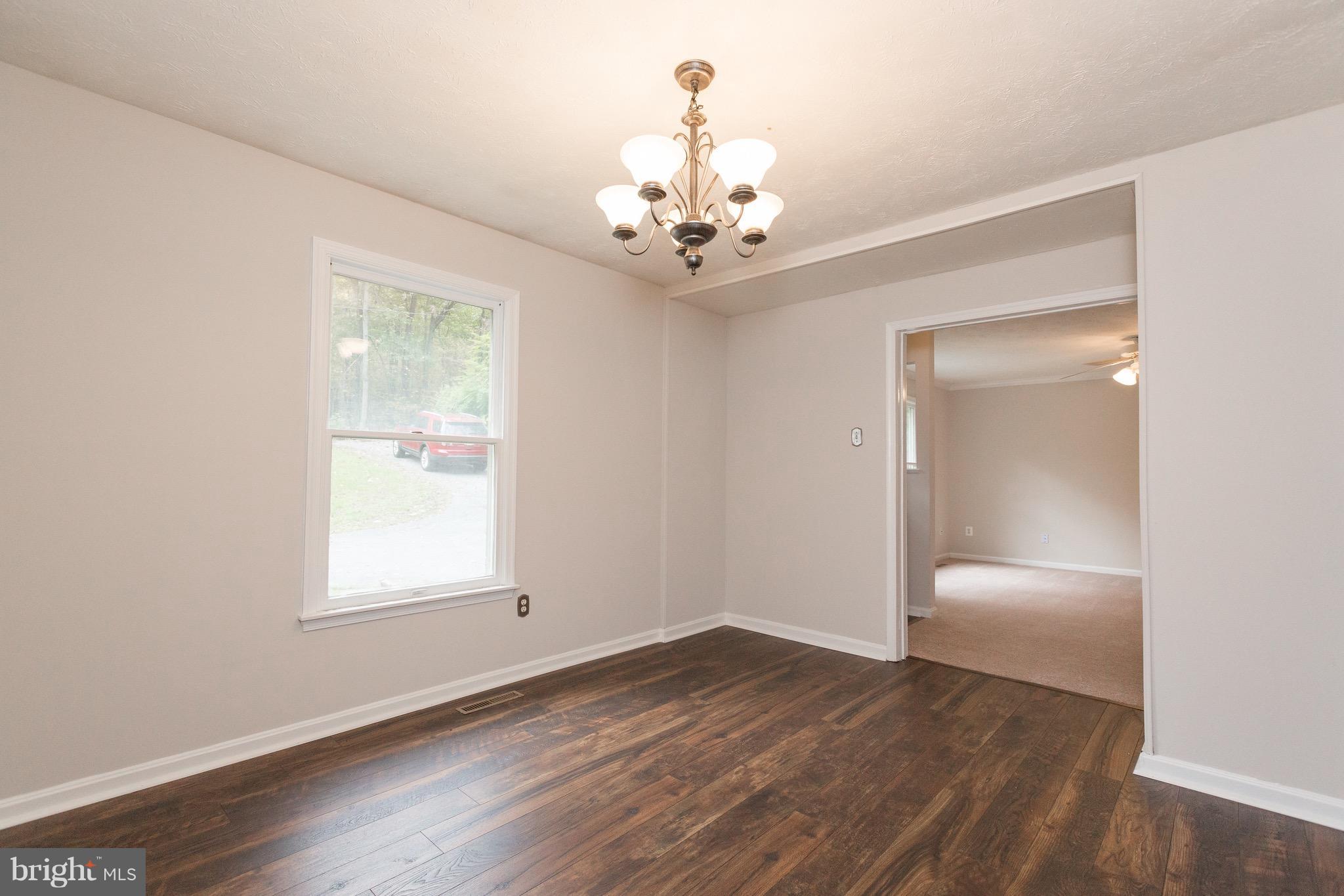 75 Locust Tree Lane Front Royal, VA 22630 - Photo 6 of 27 a view of an empty room with a window