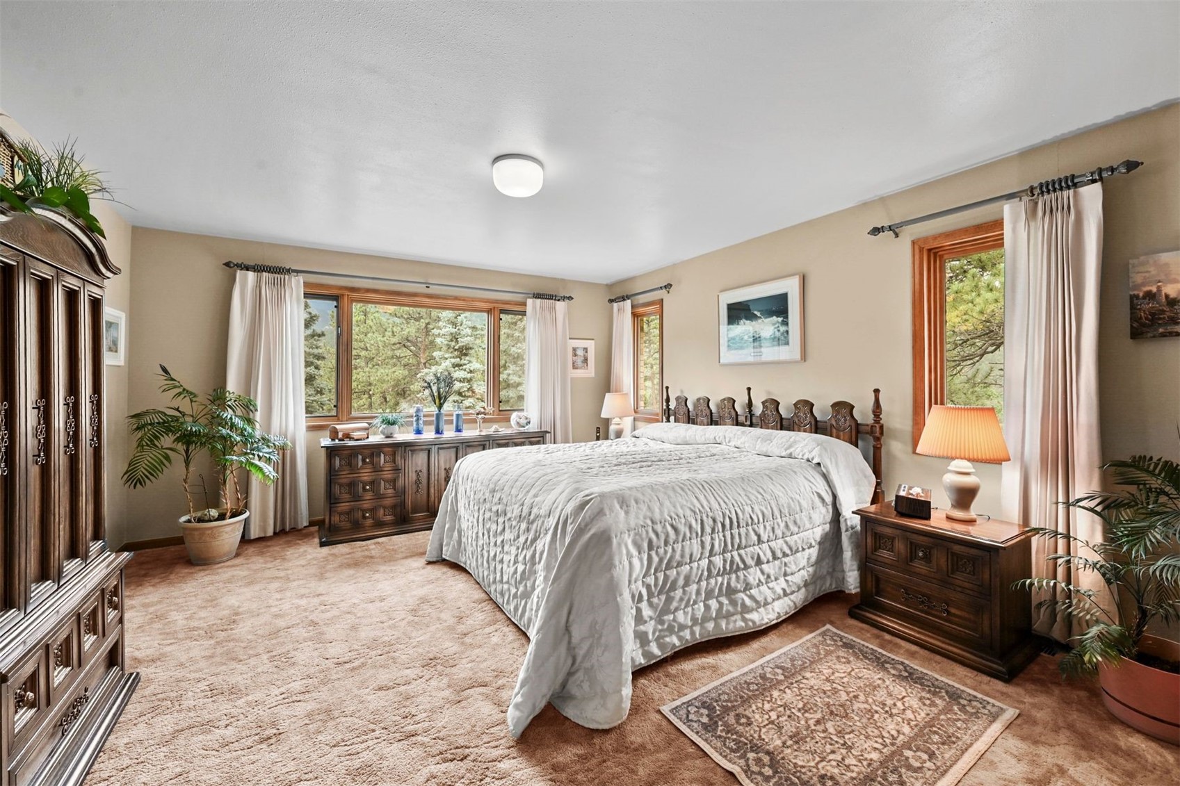 901 County Road 64 Bailey, CO 80421 - Photo 17 of 41 a spacious bedroom with a bed and a large window