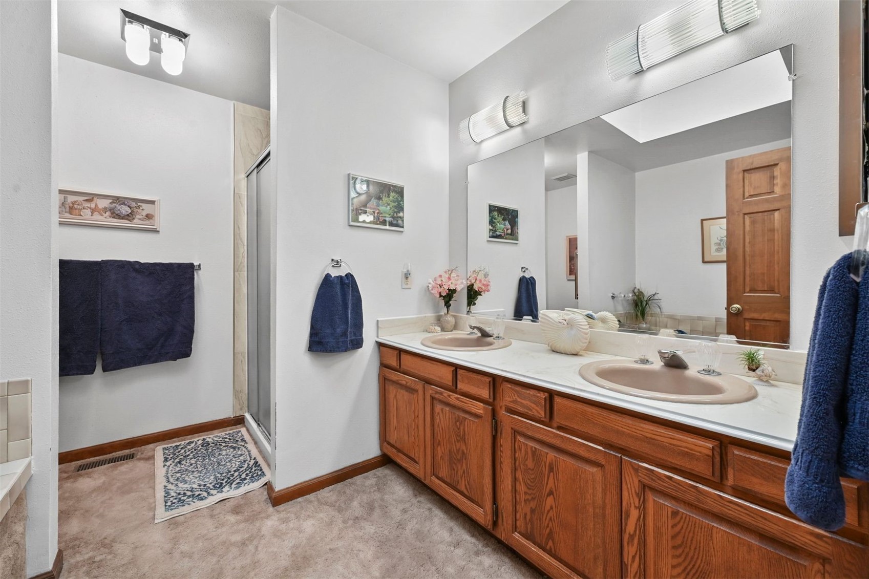 901 County Road 64 Bailey, CO 80421 - Photo 18 of 41 a en suite bathroom with double vanity and a mirror