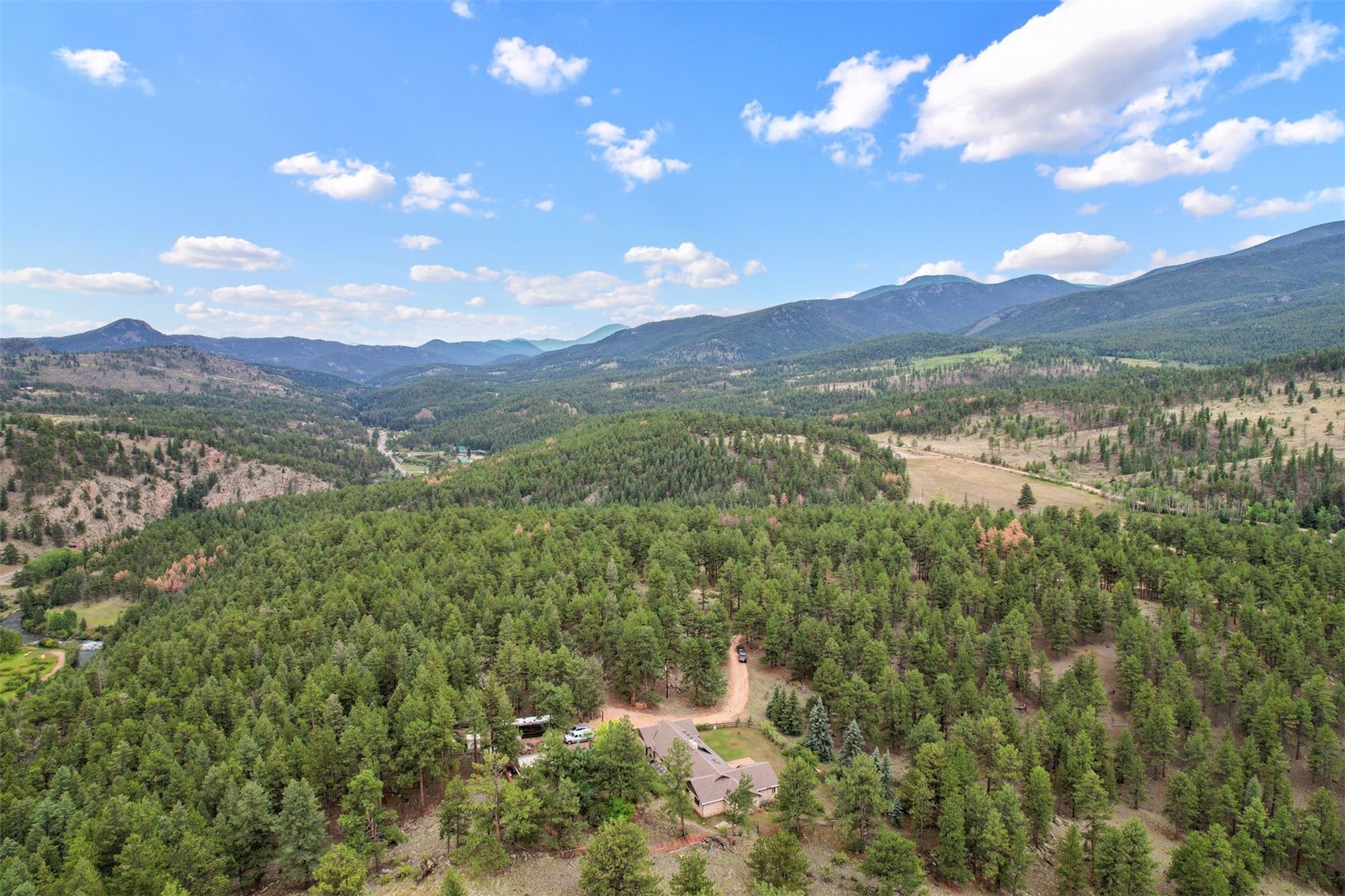 901 County Road 64 Bailey, CO 80421 - Photo 2 of 41 a view of lake with mountain