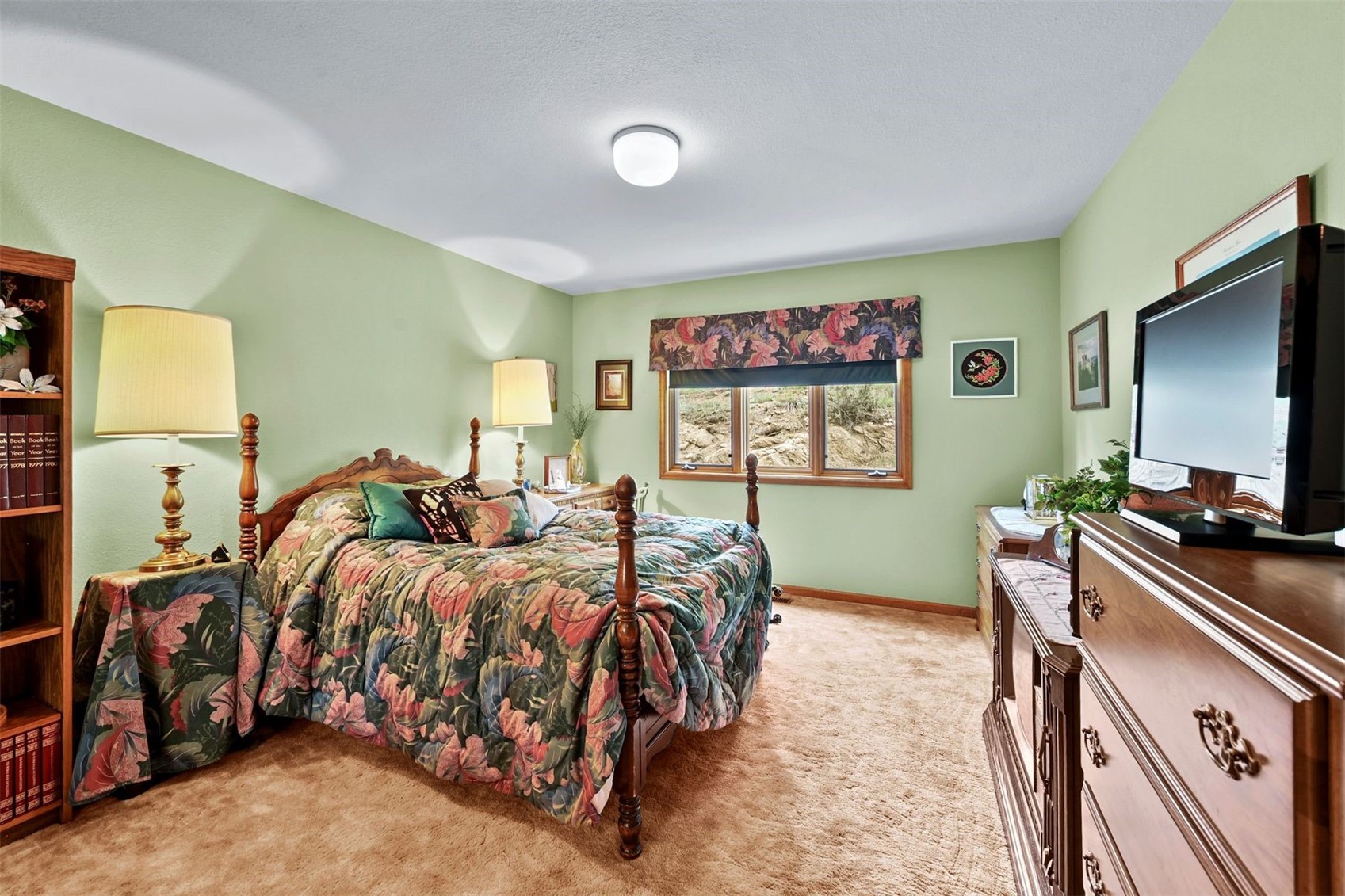 901 County Road 64 Bailey, CO 80421 - Photo 22 of 41 a bedroom with a bed and a flat screen tv