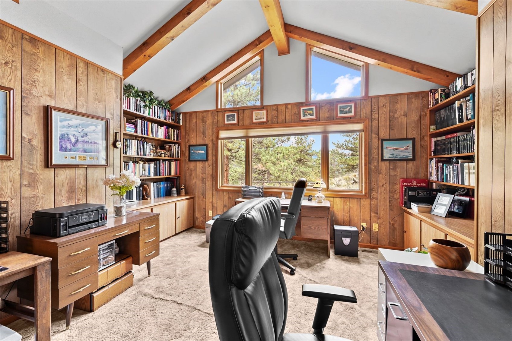 901 County Road 64 Bailey, CO 80421 - Photo 24 of 41 a view of a workspace with furniture and a bookshelf