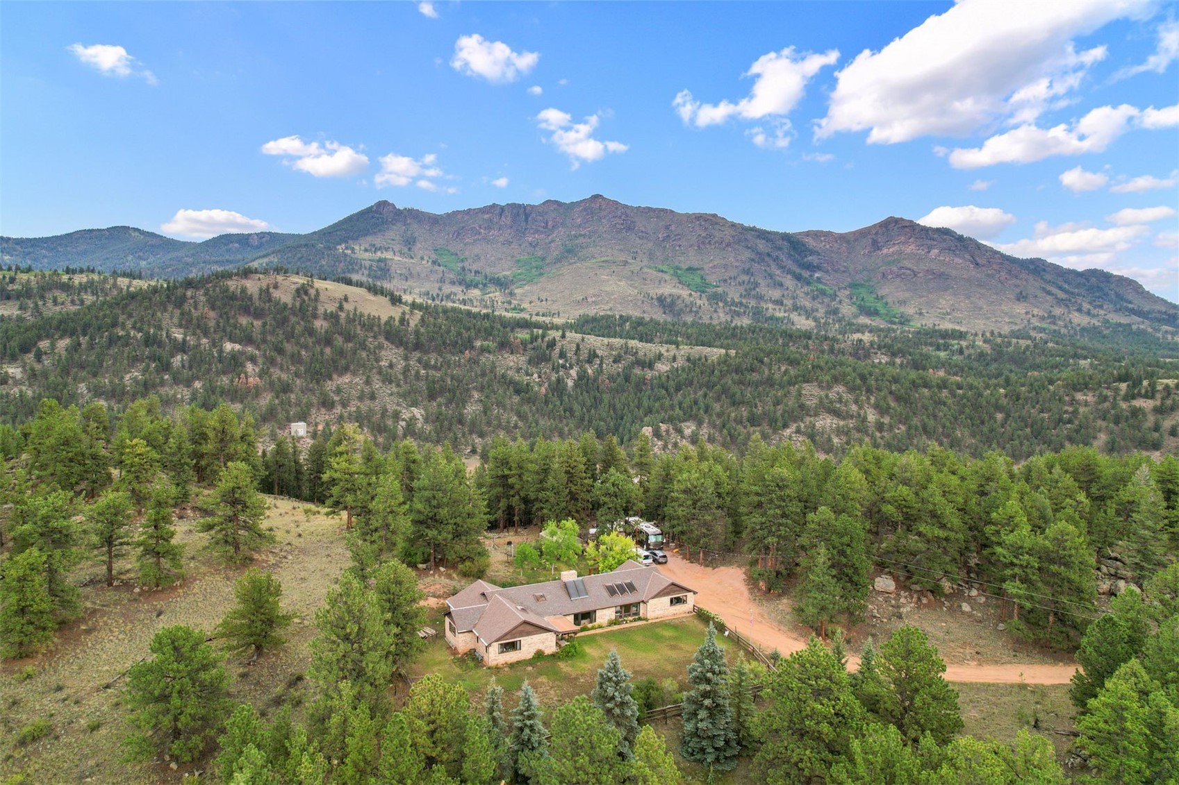 901 County Road 64 Bailey, CO 80421 - Photo 35 of 41 a view of a lush green hillside and houses