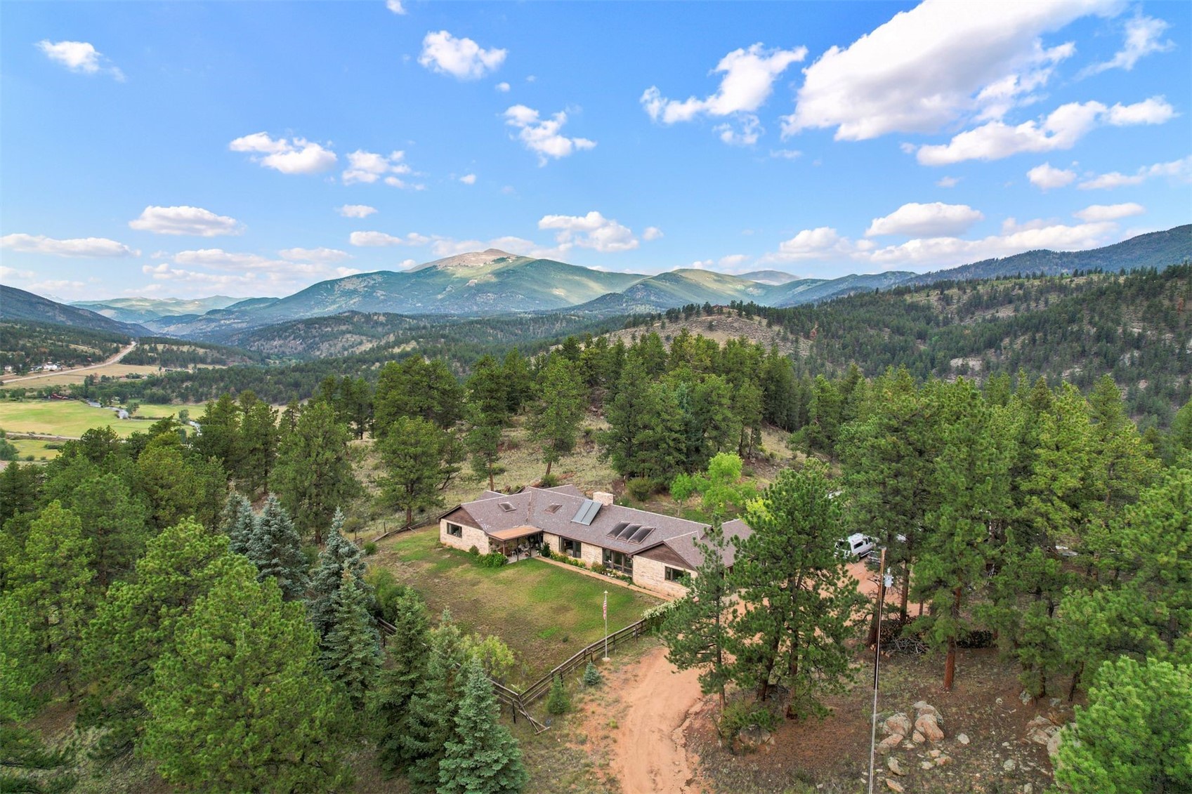 901 County Road 64 Bailey, CO 80421 - Photo 8 of 41 a view of a lake with green space