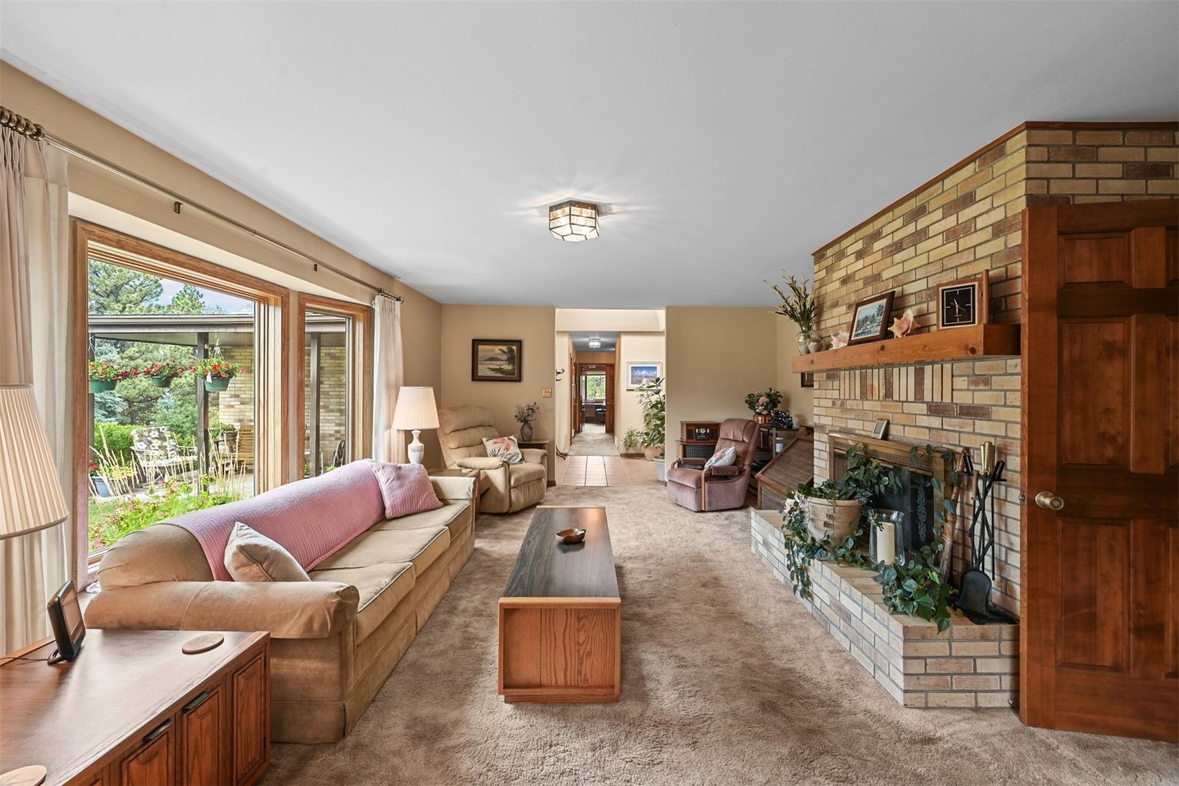 901 County Road 64 Bailey, CO 80421 - Photo 10 of 41 a living room with furniture and a floor to ceiling window