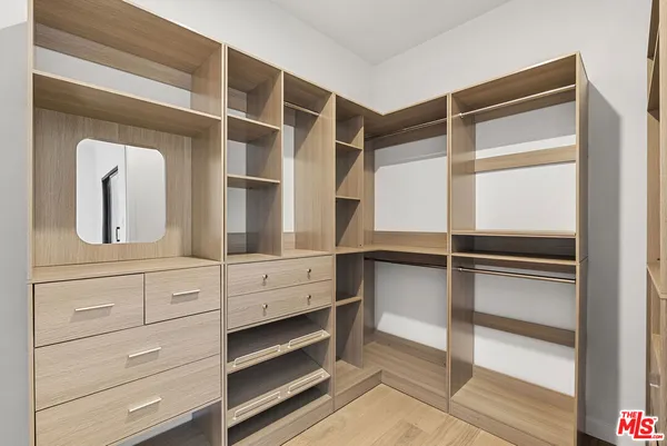 a view of an empty walk in closet
