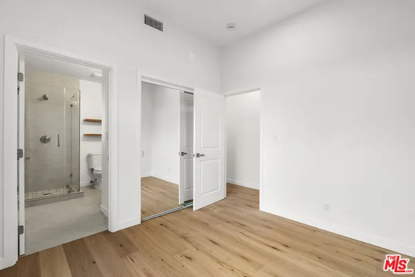 a bathroom with a toilet sink and shower