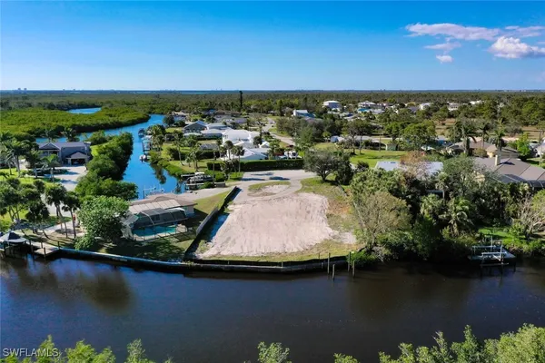 an aerial view of house with yard swimming pool and outdoor seating