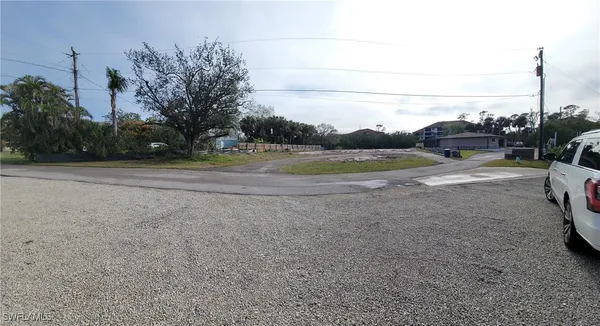 a view of a road with a big yard