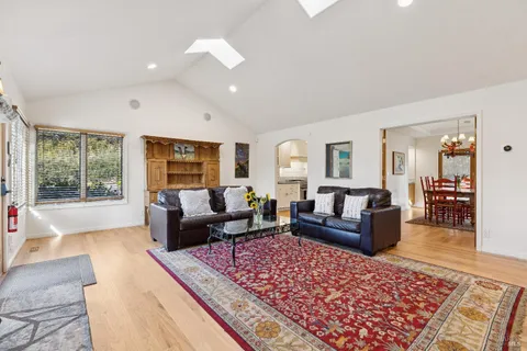 a living room with furniture and a rug