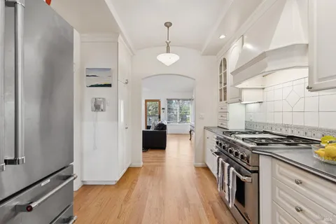 a view of an entryway with wooden floor