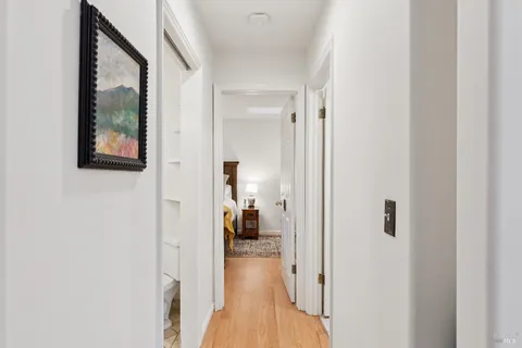 a view of a bathroom from a hallway