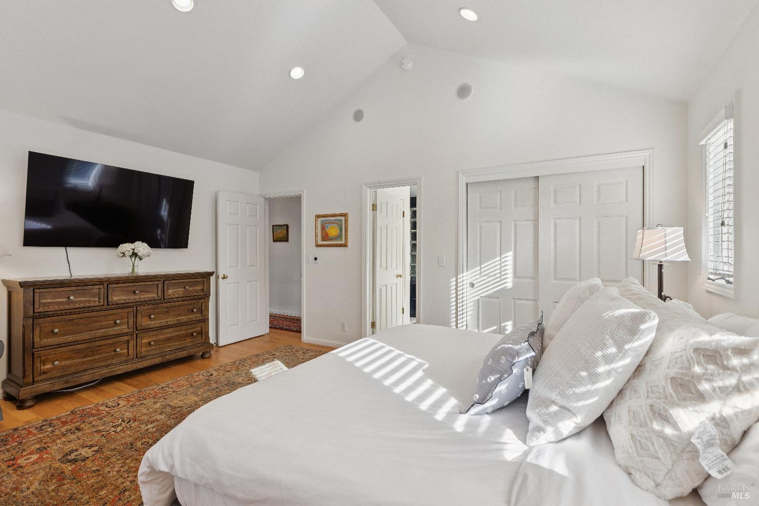 3556 Wood Valley Road Sonoma, CA 95476 - Photo 18 of 33 a bedroom with a bed and a flat screen tv