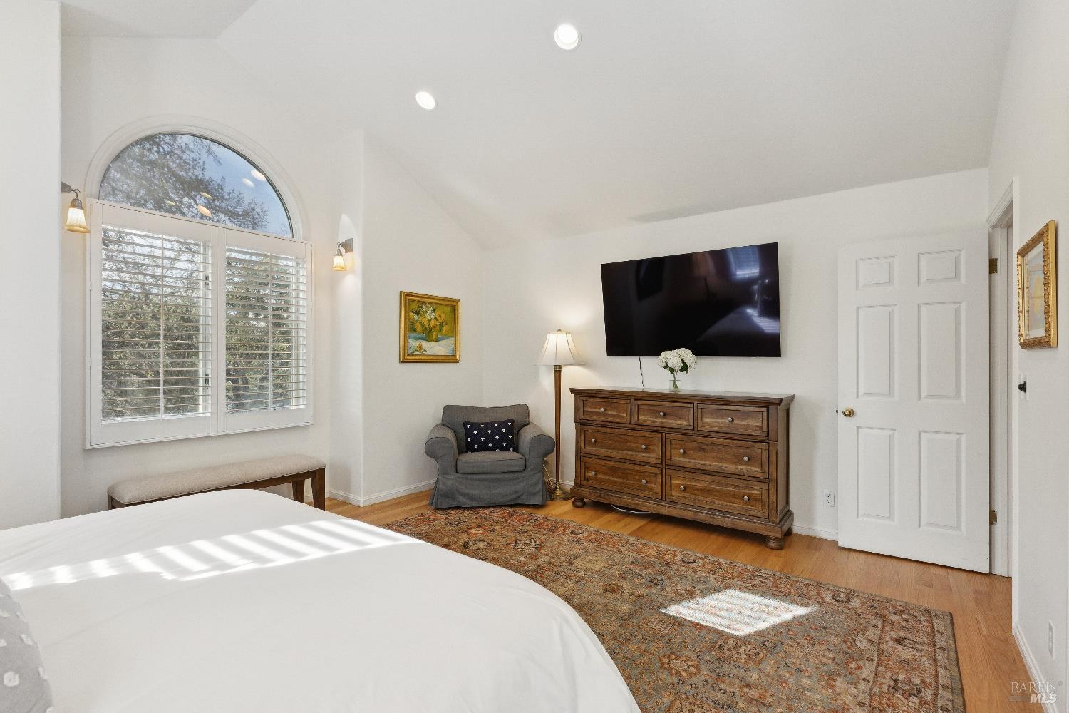 3556 Wood Valley Road Sonoma, CA 95476 - Photo 25 of 40 a bedroom with bed and flat screen tv