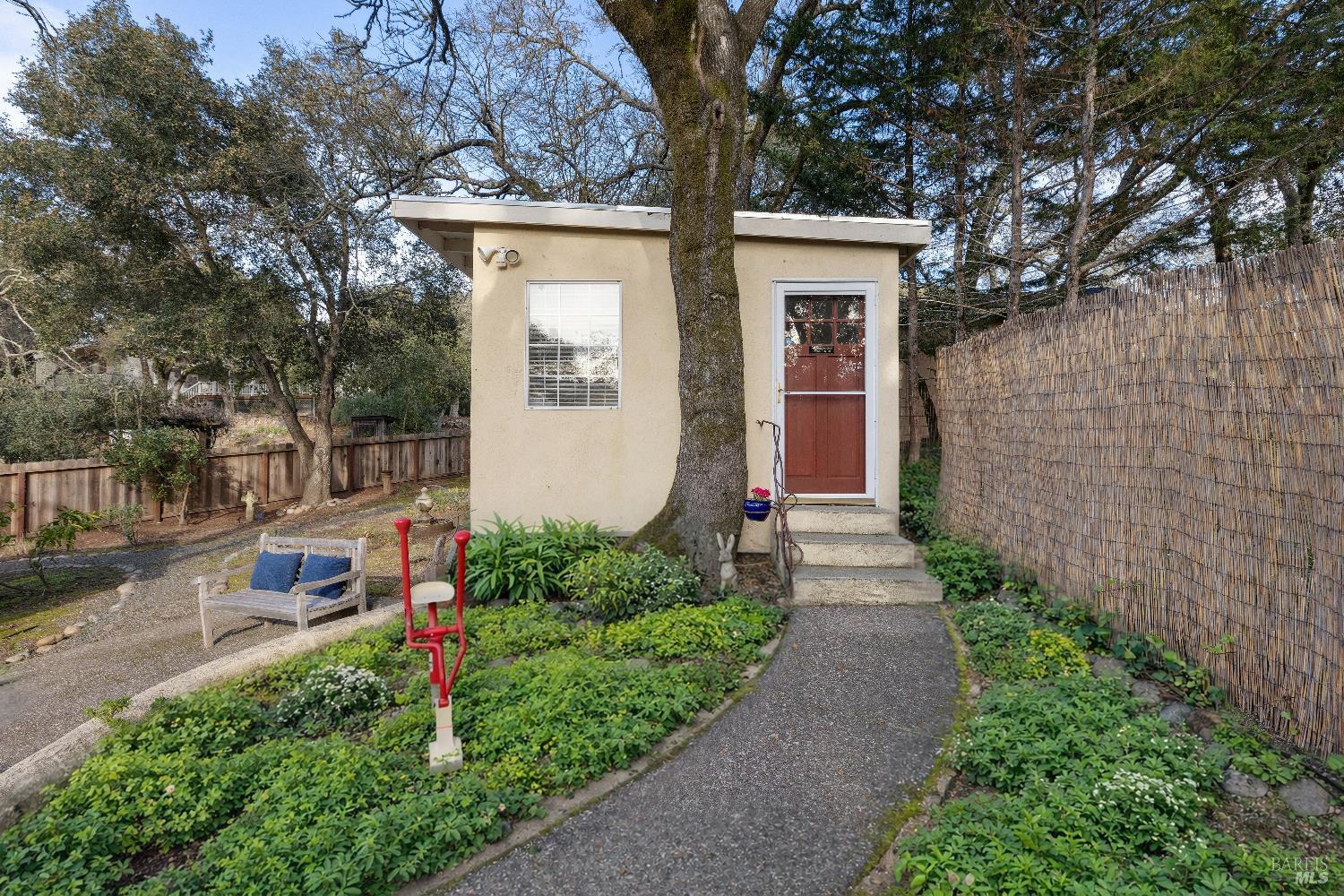 3556 Wood Valley Road Sonoma, CA 95476 - Photo 28 of 40 a front view of a house with a yard and potted plants