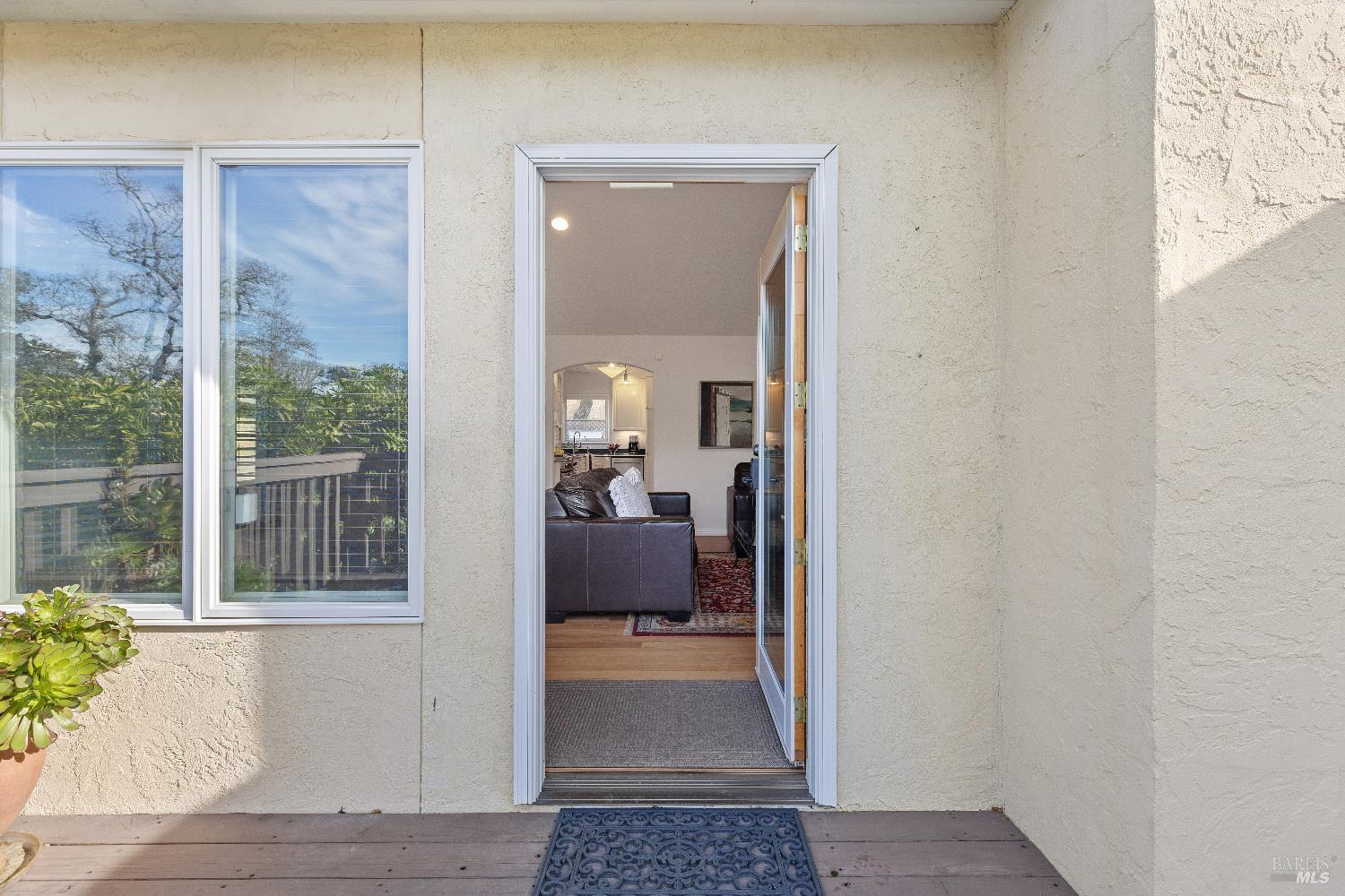 3556 Wood Valley Road Sonoma, CA 95476 - Photo 5 of 33 a view of a hallway with wooden floor and a livingroom