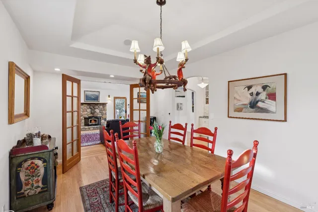 a kitchen with stainless steel appliances granite countertop a stove and white cabinets