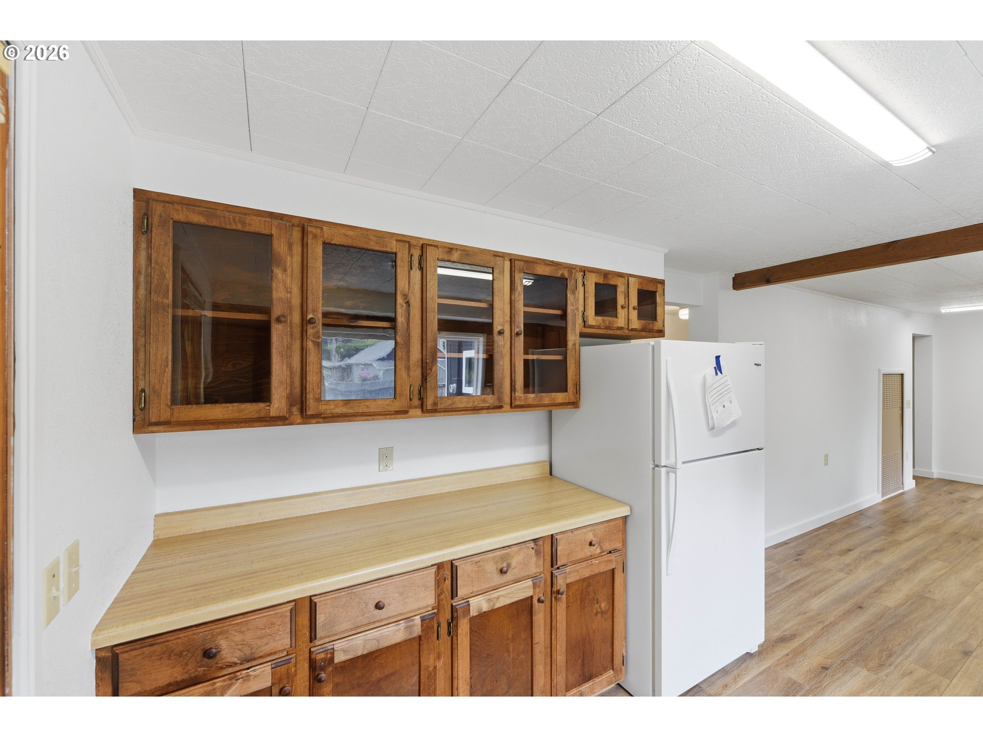 63299 Wildahl Road Coos Bay, OR 97420 - Photo 25 of 45 a kitchen with a refrigerator and a cabinets