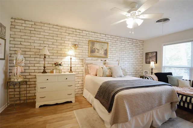 a bed room with a bed and a window