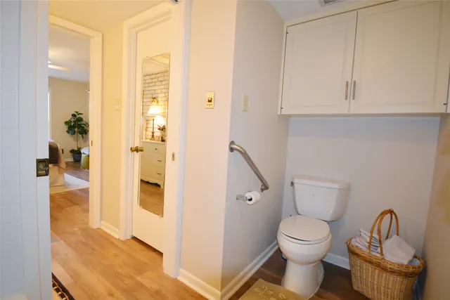 a bathroom with a toilet and a shower