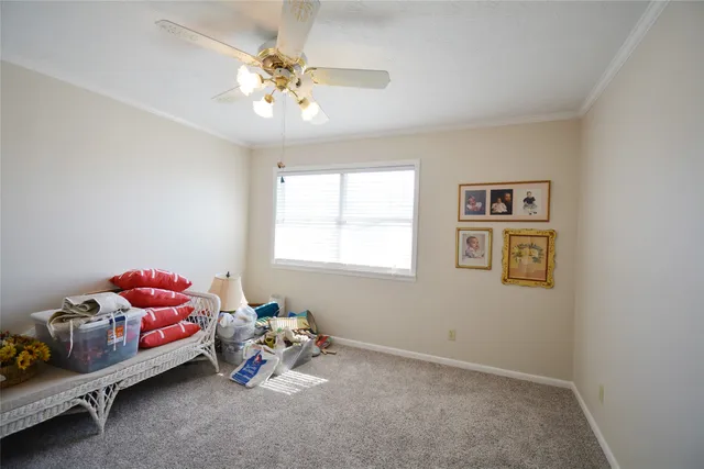 a bedroom with bed and a chandelier