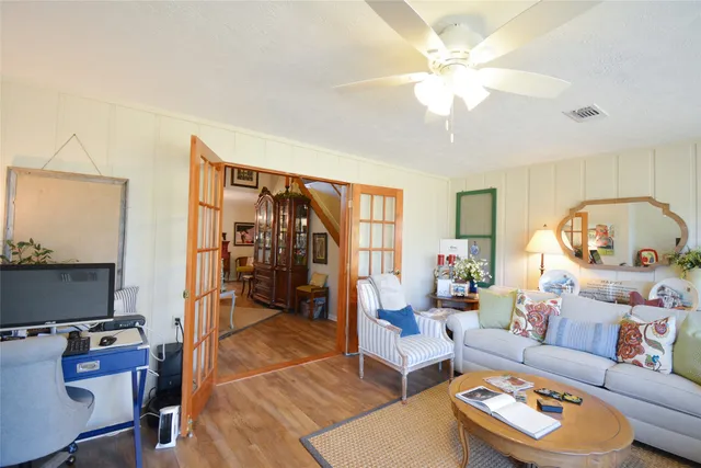 a bathroom with a granite countertop sink a toilet and a mirror