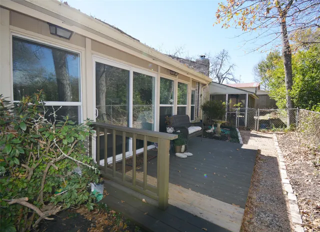 a view of a house with backyard sitting area and garden