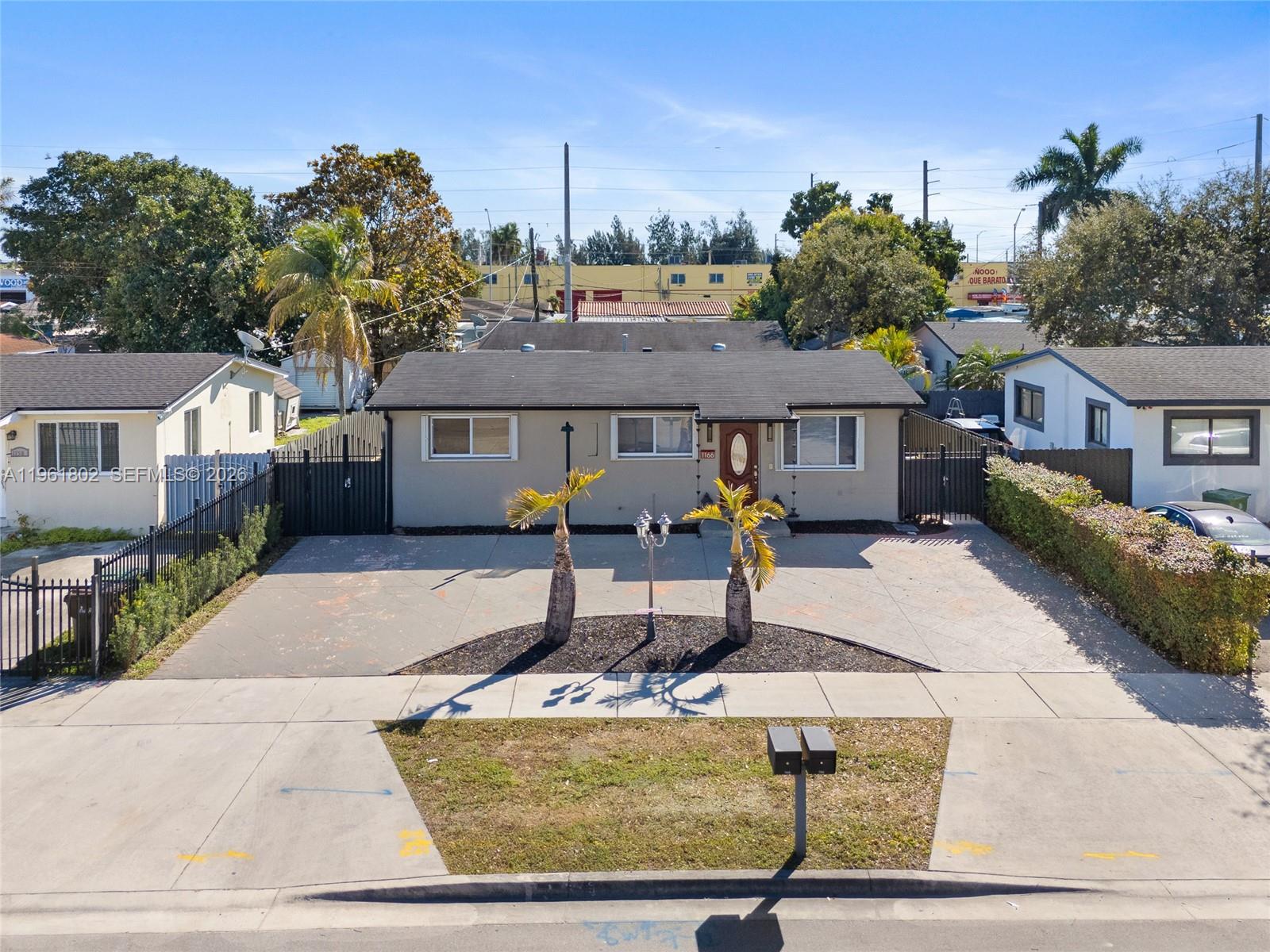 1166 West 24th Street Hialeah, FL 33010 - Photo 1 of 45 a house view with a garden space