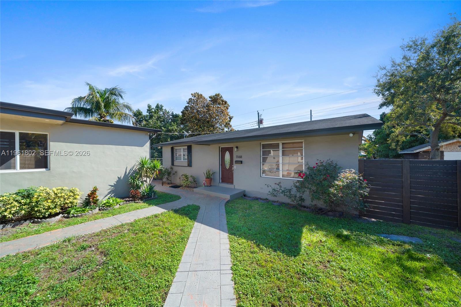 1166 West 24th Street Hialeah, FL 33010 - Photo 17 of 45 a front view of a house with garden
