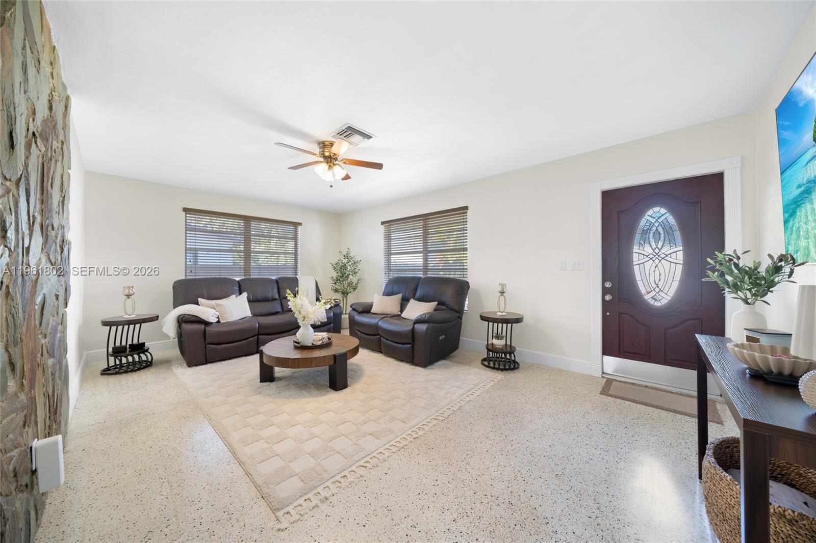 1166 West 24th Street Hialeah, FL 33010 - Photo 19 of 45 a living room with furniture and a large window