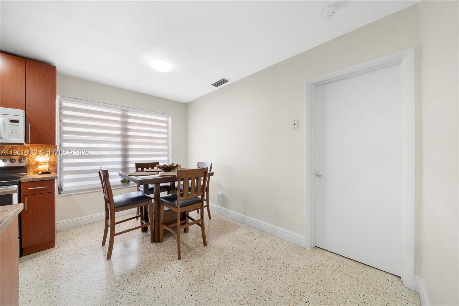 1166 West 24th Street Hialeah, FL 33010 - Photo 24 of 45 a dining room with furniture and window