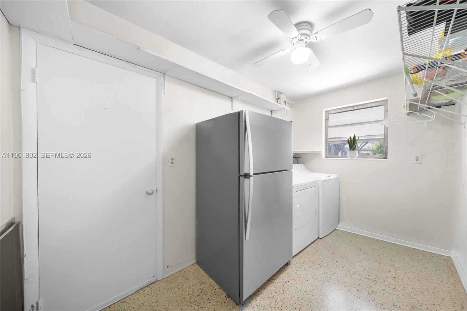 1166 West 24th Street Hialeah, FL 33010 - Photo 25 of 45 a view of a kitchen with closet and a ceiling fan