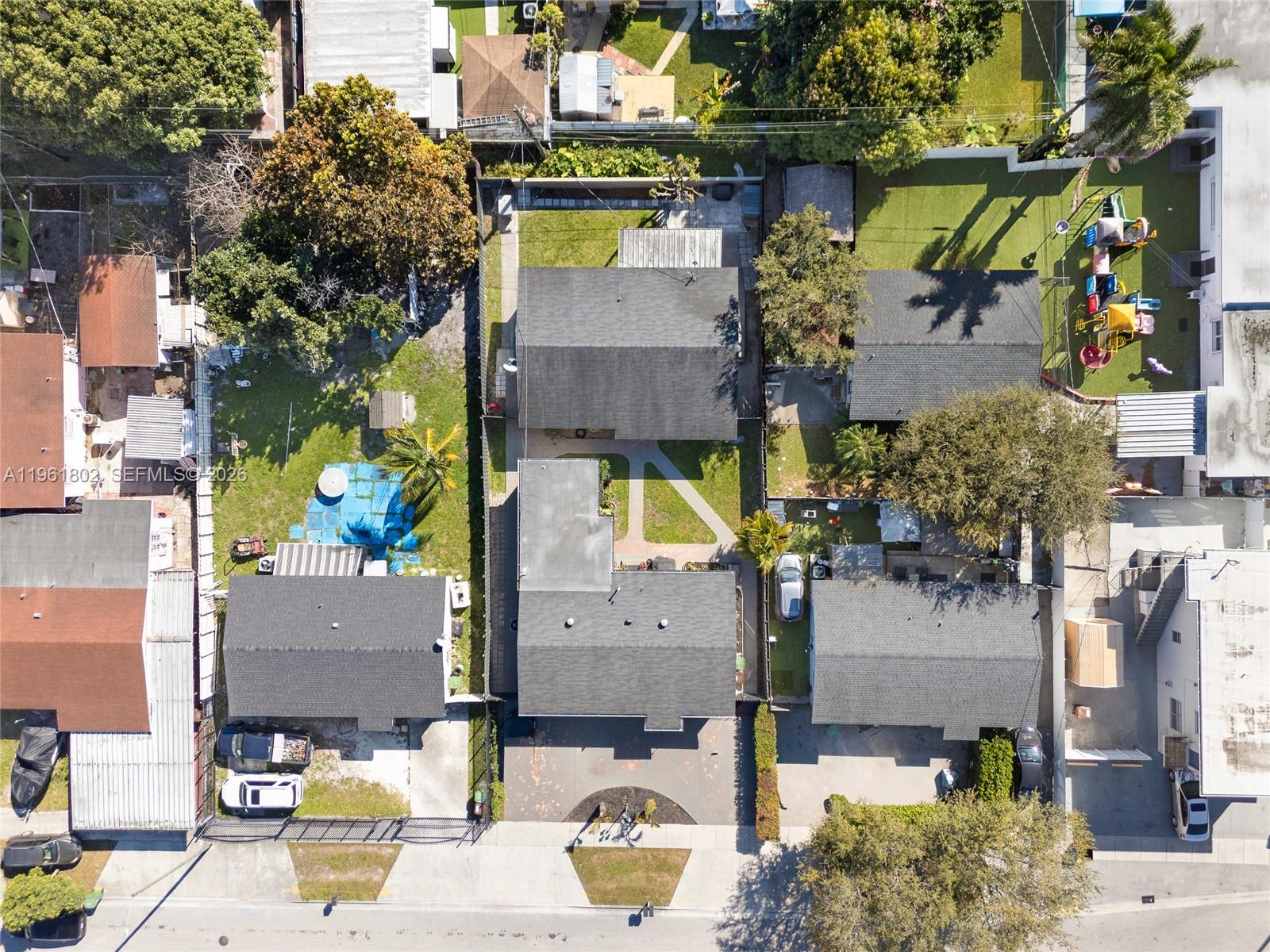 1166 West 24th Street Hialeah, FL 33010 - Photo 34 of 45 an aerial view of houses with outdoor space
