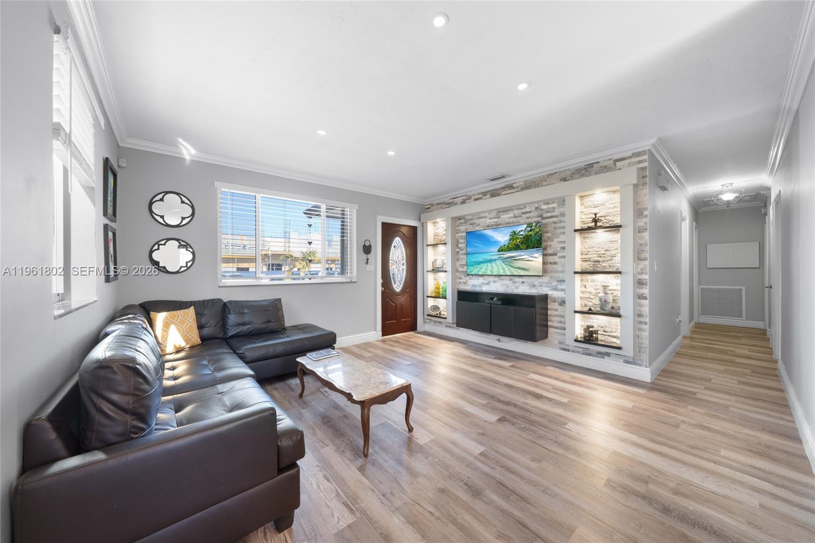 1166 West 24th Street Hialeah, FL 33010 - Photo 4 of 45 a living room with furniture and a wooden floor