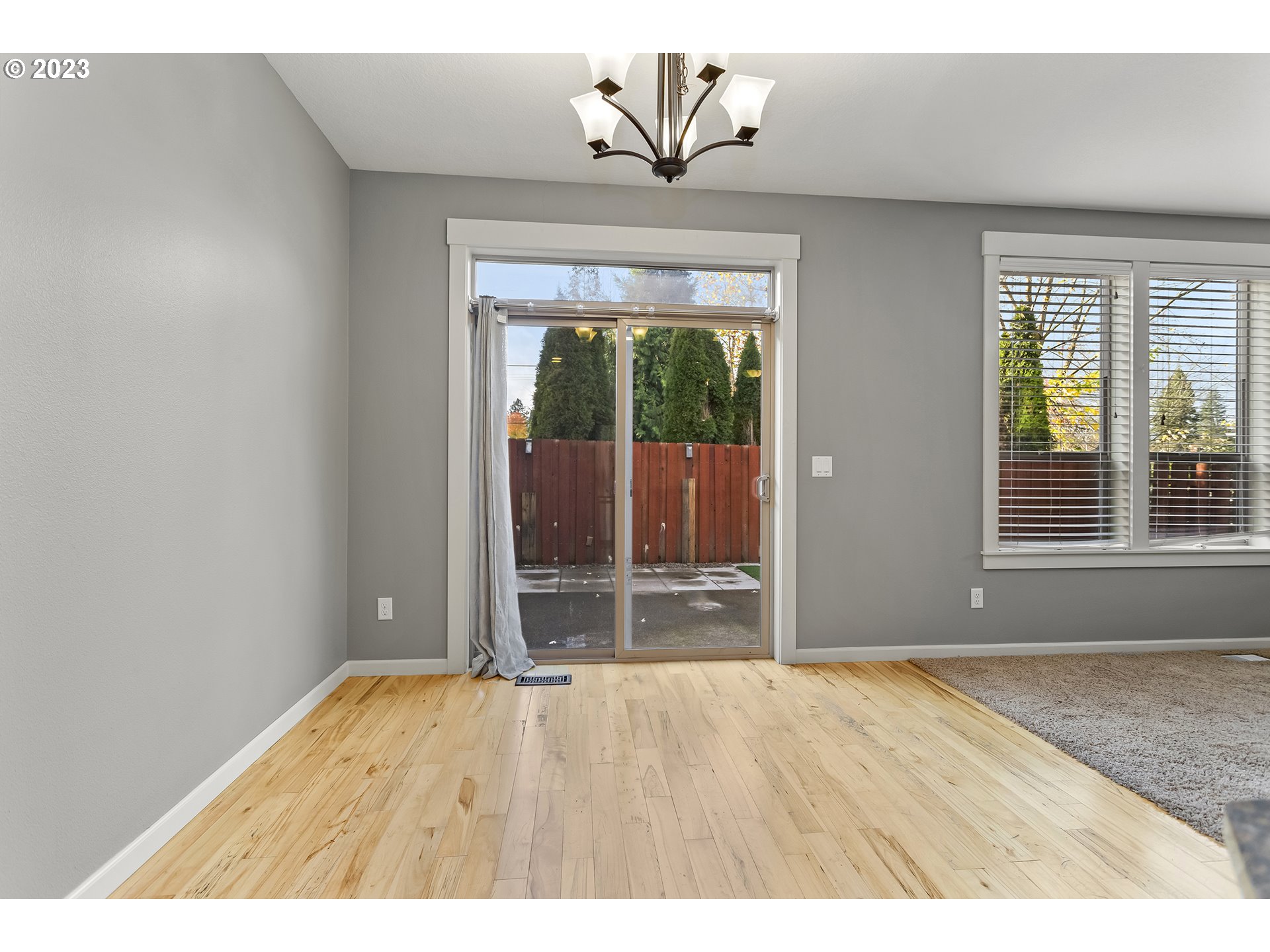 2267 Southwest 184th Terrace Beaverton, OR 97003 - Photo 16 of 39 an empty room with wooden floor and windows