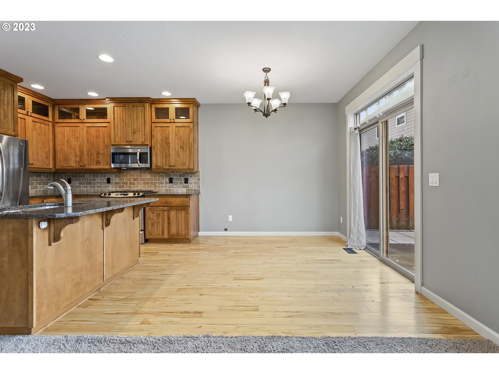 2267 Southwest 184th Terrace Beaverton, OR 97003 - Photo 7 of 39 a view of kitchen with stainless steel appliances granite countertop a stove top oven