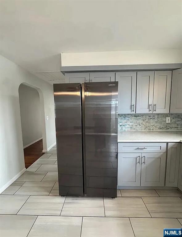 309 East 17th Street, Unit 2 Paterson, NJ 07524 - Photo 2 of 9 a kitchen with cabinets and stainless steel appliances