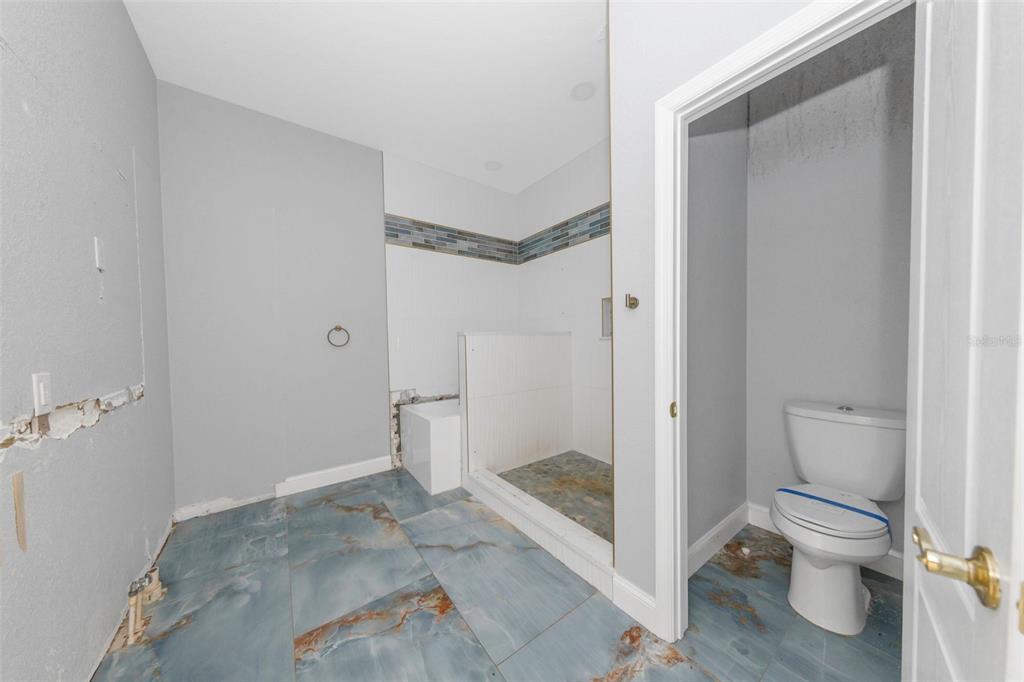 20138 Bowman Road Spring Hill, FL 34610 - Photo 31 of 40 a bathroom with a shower and toilet