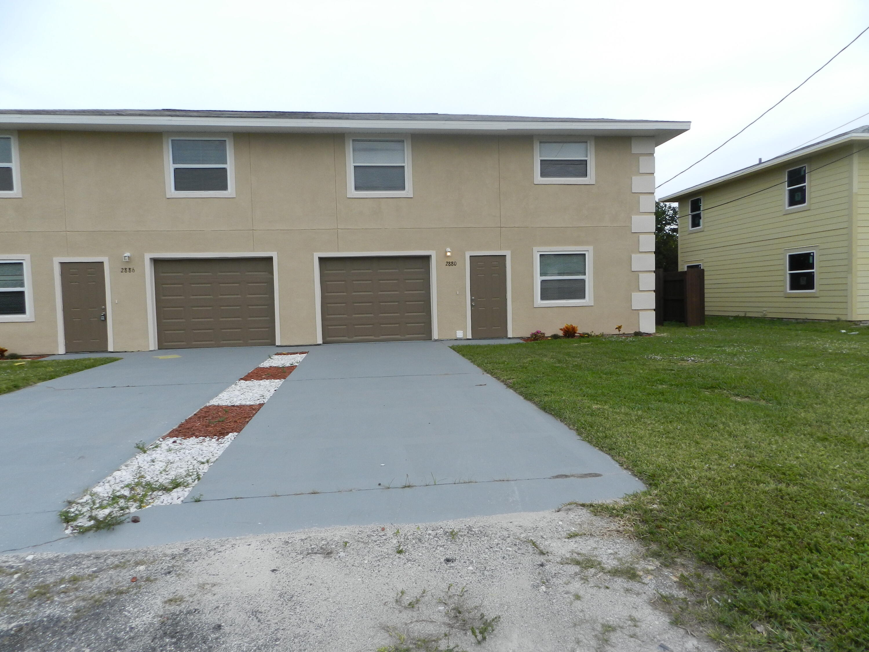 2880 Harson Way Fort Pierce, FL 34946 - Photo 1 of 40 a backyard of a house