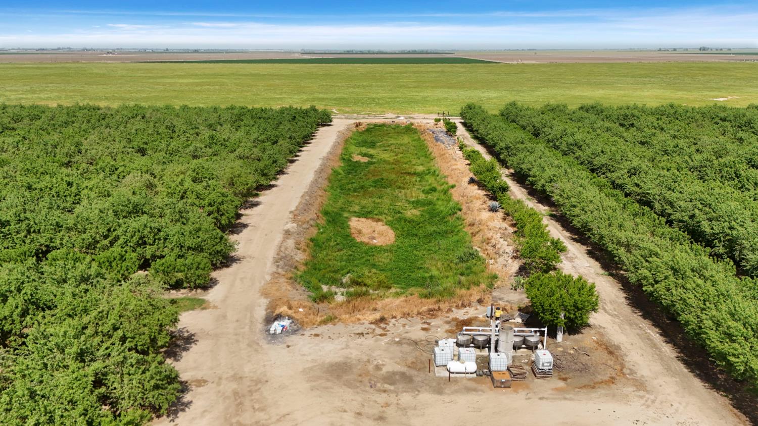 4866 East Roosevelt Road Chowchilla, CA 93610 - Photo 15 of 30 Booster pump and reservoir for Chowchilla Water District for irrigation