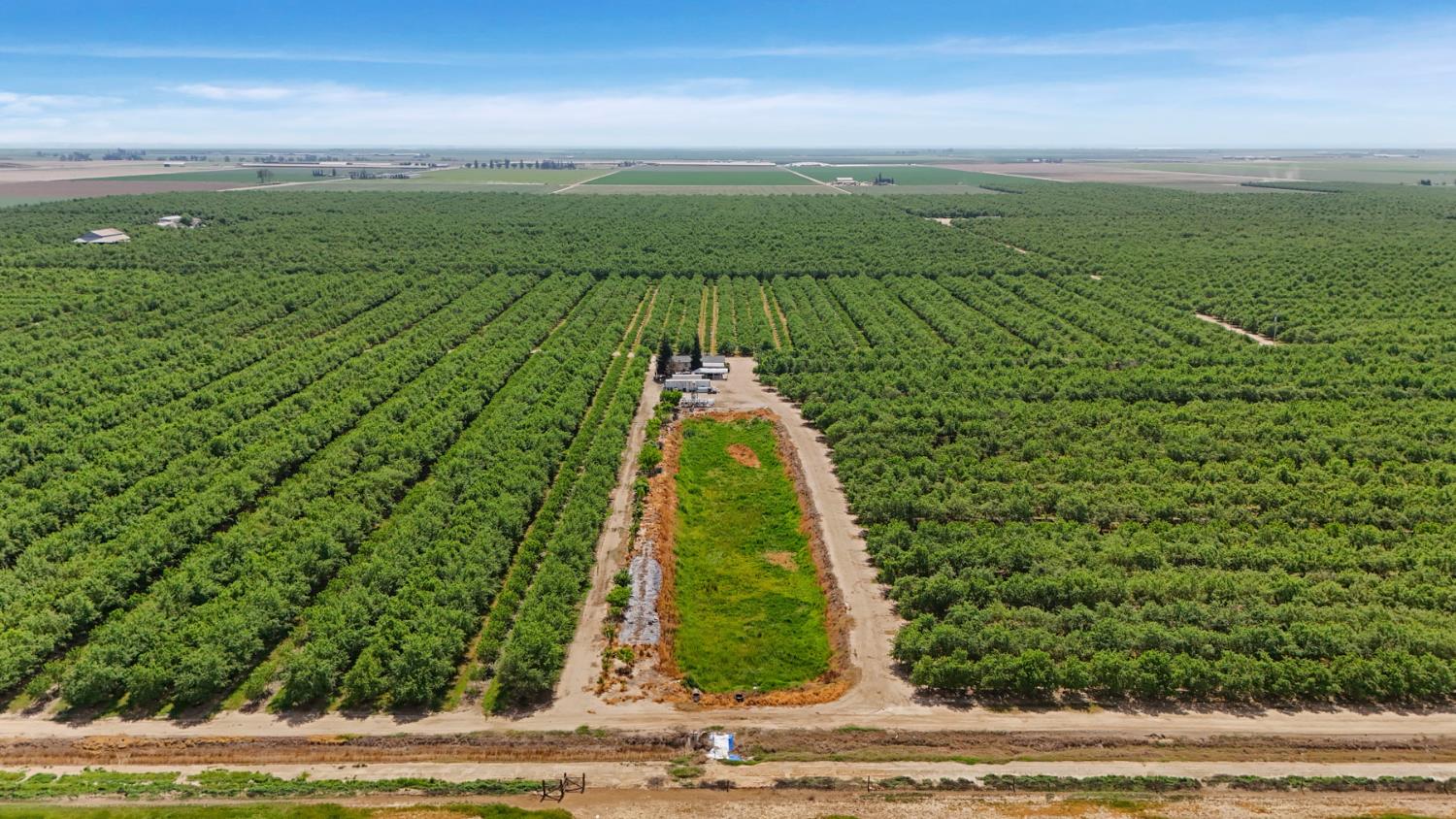 4866 East Roosevelt Road Chowchilla, CA 93610 - Photo 17 of 30 Booster pump and reservoir for Chowchilla Water District for irrigation. Notice the CWD Inlet on canal into reservoir.