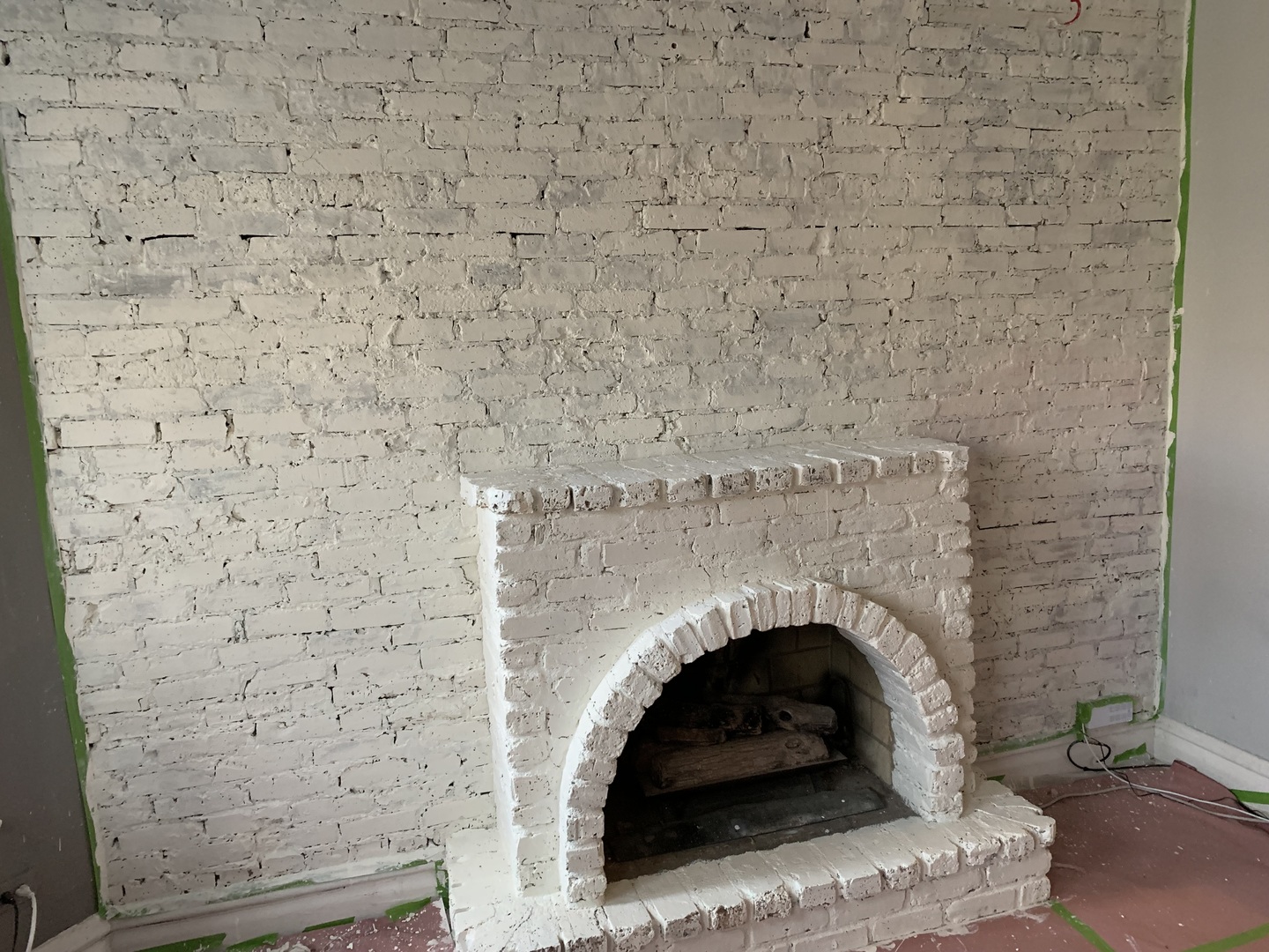 Undisclosed Address Chicago, IL 60613 - Photo 3 of 5 a living room with a fireplace