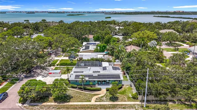 a large kitchen with a lot of counter space and stainless steel appliances